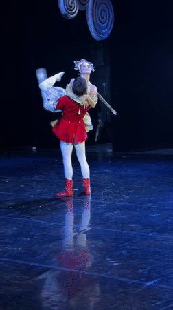 Classical ballet performance on a dramatic lit stage in Ufa