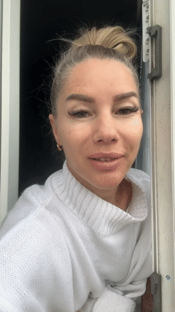 Woman enjoys petrichor scent during early morning rainstorm in Abakan