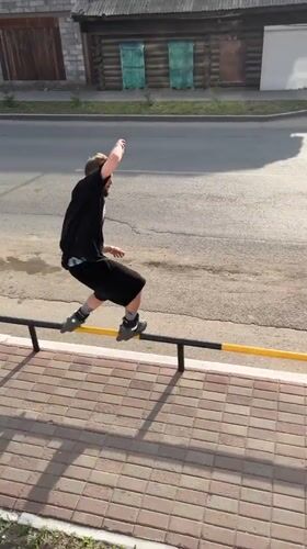 Rollerblade rail tricks filmed on a Kansk sidewalk