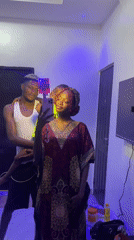 Woman takes mirror selfie in traditional dress, Igboefon Nigeria