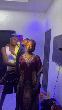Woman takes mirror selfie in traditional dress, Igboefon Nigeria