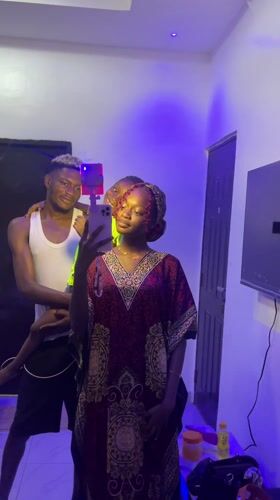 Woman takes mirror selfie in traditional dress, Igboefon Nigeria