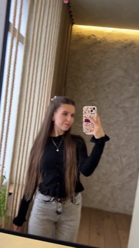 Woman Takes Mirror Selfies in Klin, Russia