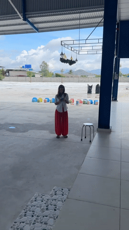 Early morning bus stop activities documented in Ham Kiem