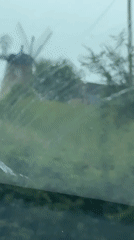 Traditional windmill filmed from moving vehicle in South Oxfordshire