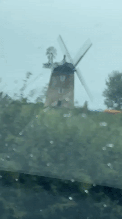 Traditional windmill filmed from moving vehicle in South Oxfordshire