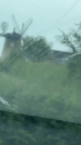 Traditional windmill filmed from moving vehicle in South Oxfordshire
