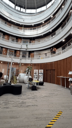 Circular atrium and banner display inside a large indoor venue