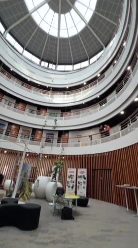 Circular atrium and banner display inside a large indoor venue