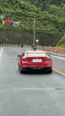 Red Toyota 86 spotted driving highway near Sukasada, Indonesia