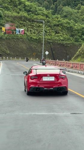 Red Toyota 86 spotted driving highway near Sukasada, Indonesia