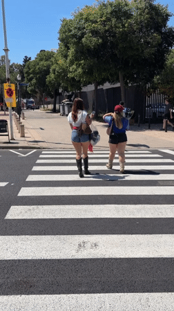 Barcelona morning scenes: pedestrians, statue, tower, rugby field documented