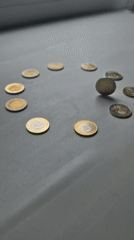 Coins arranged in circle formation captured on video in Kokshetau