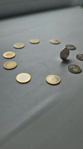 Coins arranged in circle formation captured on video in Kokshetau