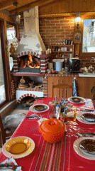 Cozy kitchen scene captured with lit fireplace and dining setup