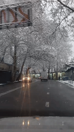 Winter snow blankets Tbilisi streets during early morning hours