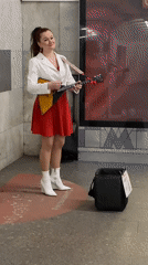 Street musician plays balalaika in Moscow metro station