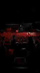 DJ performs for packed crowd at Paris nightclub