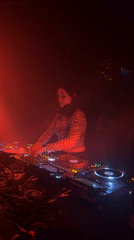 Early morning DJ set in red-lit Montreal venue