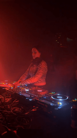 Early morning DJ set in red-lit Montreal venue