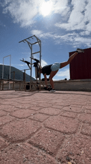 Woman exercises with dumbbells on Montenegro rooftop