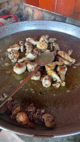 Traditional paella preparation witnessed in Spanish urbanization
