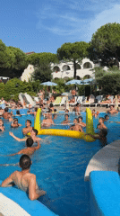 Pool games and water aerobics on a summer afternoon in Gatteo