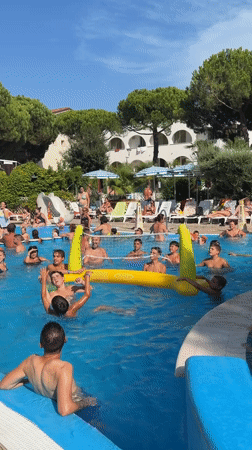 Pool games and water aerobics on a summer afternoon in Gatteo