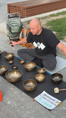 Street musicians perform near Moscow's VDNKh and space monument