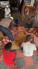 Early morning meat processing operation observed in Dhaka courtyard