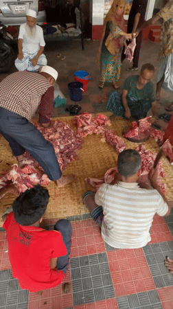 Early morning meat processing operation observed in Dhaka courtyard