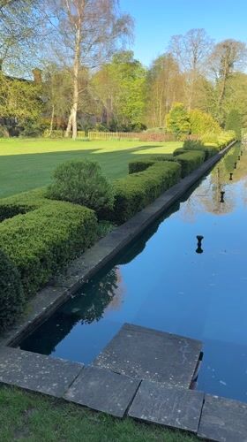 Morning stroll through formal garden in East Suffolk