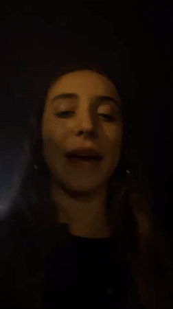 Woman films late-night beach videos in Barcelona