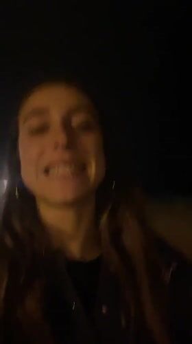 Woman films late-night beach videos in Barcelona