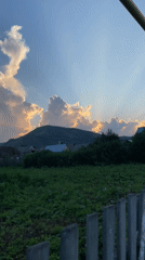 Sunset light over fields and fences in rural Maloarslangulovo