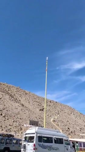 Adventure van and hilltop shrine at a Ladakh stop