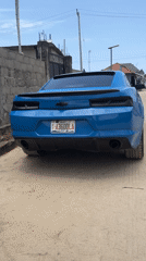 Blue Camaro and speaking man documented in Iranla, Nigeria