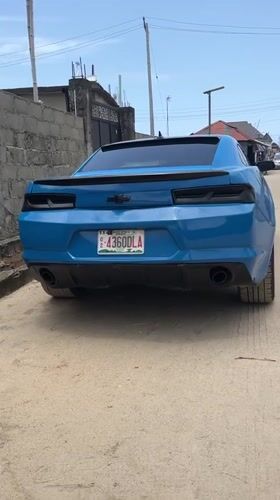 Blue Camaro and speaking man documented in Iranla, Nigeria
