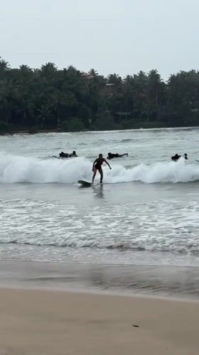 Dawn surfing session in choppy waters off Dikwella