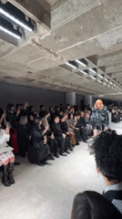 Fashion show features model in leather outfit at Paris venue