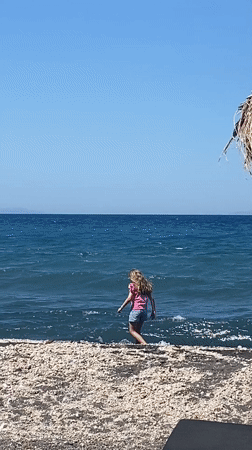 Afternoon at a Santorini beach, waterside and bar scene