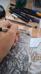 Ink illustration session in progress, with a kitten in attendance