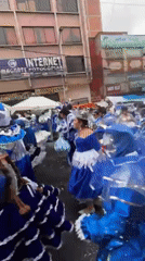 Traditional Andean dancers parade through La Paz streets in colorful celebration