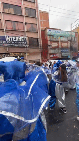 Traditional Andean dancers parade through La Paz streets in colorful celebration