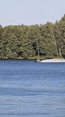 Jet skiing on a calm lake outside Brest, Belarus