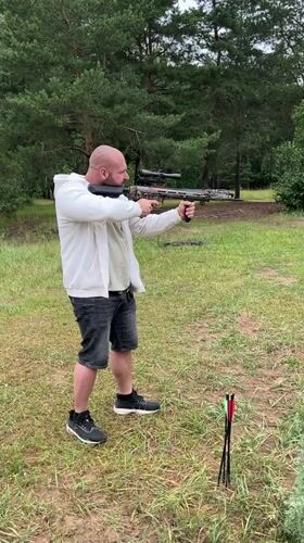 Crossbow target practice in a grassy outdoor spot near Noviy