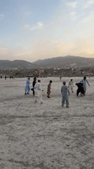 Children and adults play sports in Quetta afternoon scenes