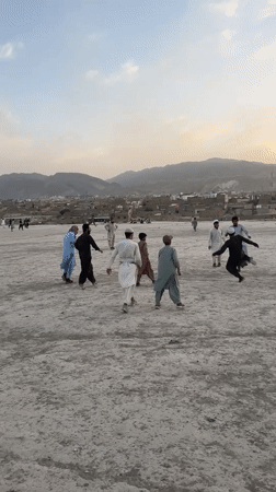 Children and adults play sports in Quetta afternoon scenes