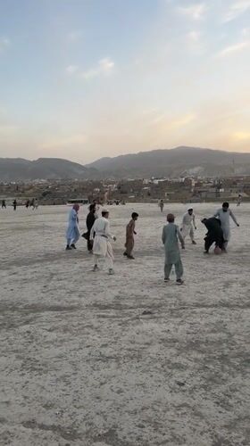 Children and adults play sports in Quetta afternoon scenes