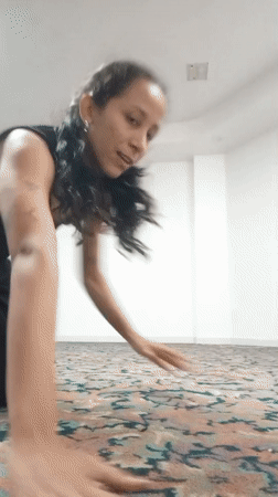 Woman performs gymnastics routine in Porlamar resort room